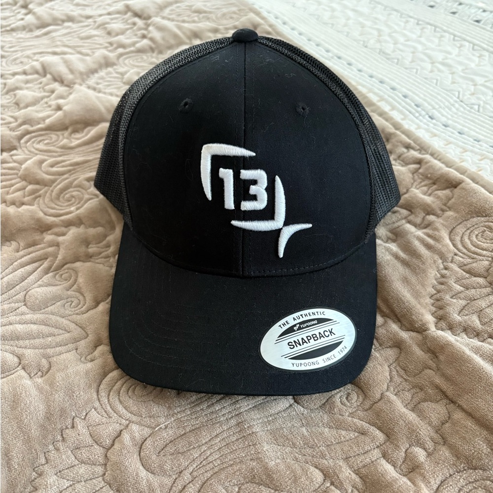 13 Fishing "Make Your Own Luck" black snapback cap, by Yupoong